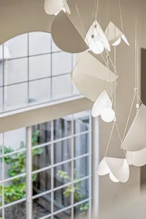 a close view of light fixtures and wooden floor