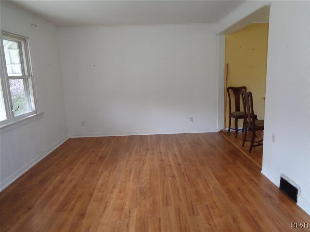 2919 Middletown Road Bethlehem, PA 18020 - Photo 6 of 23 an empty room with wooden floor and windows