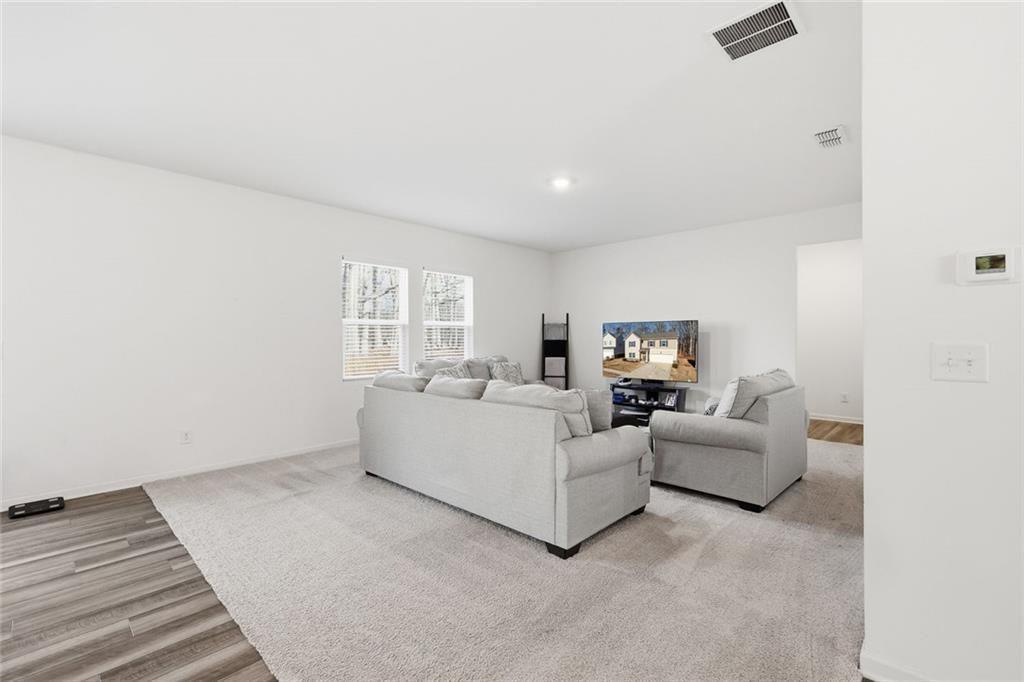 628 Knightsbridge Lane Winder, GA 30680 - Photo 12 of 42 a living room with furniture and wooden floor