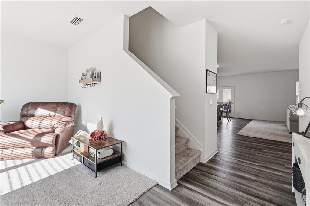 628 Knightsbridge Lane Winder, GA 30680 - Photo 17 of 42 a bedroom with furniture and a wooden floor