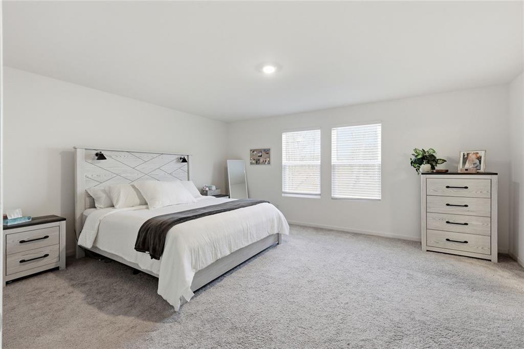 628 Knightsbridge Lane Winder, GA 30680 - Photo 19 of 42 a bed room with a bed and a window