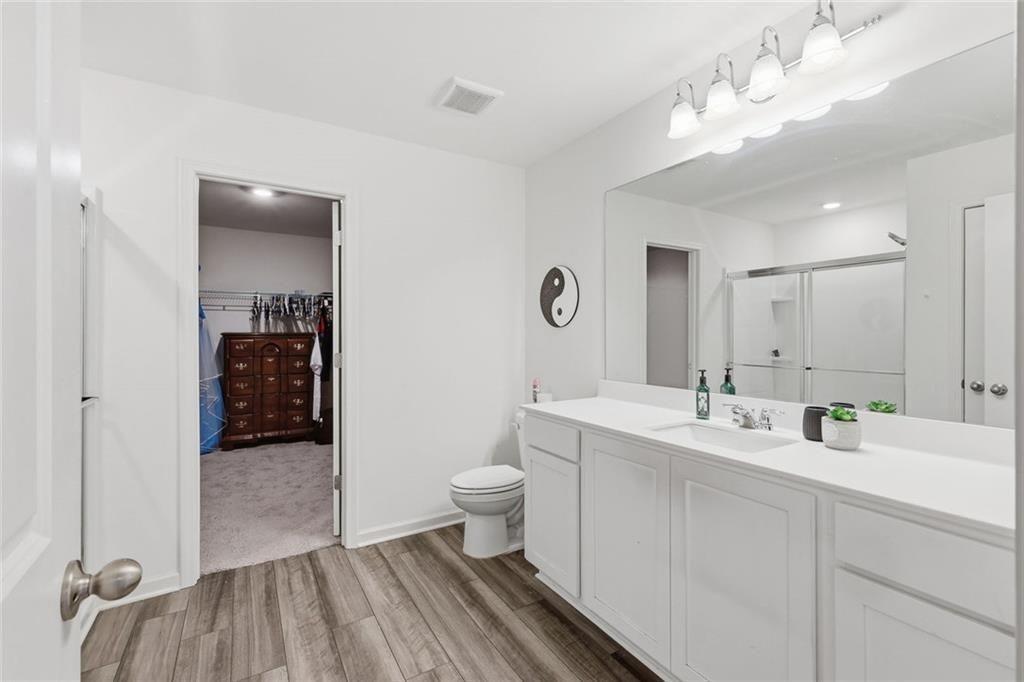 628 Knightsbridge Lane Winder, GA 30680 - Photo 21 of 42 a bathroom with a sink a toilet and shower