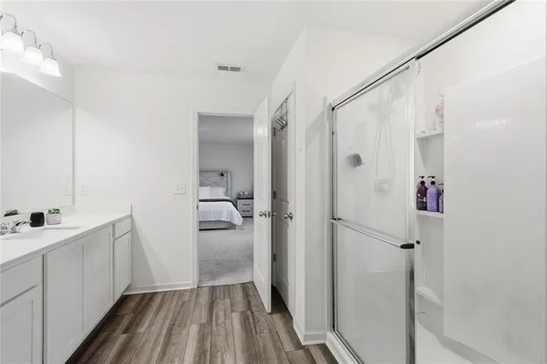 a bathroom with a sink and shower