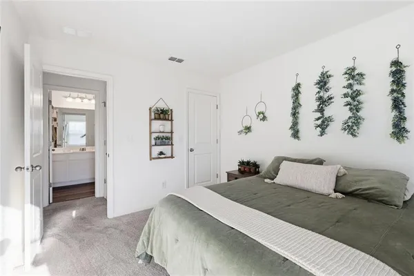 a bedroom with a bed and a couch