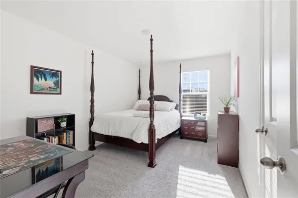 a bed room with a bed and a couch