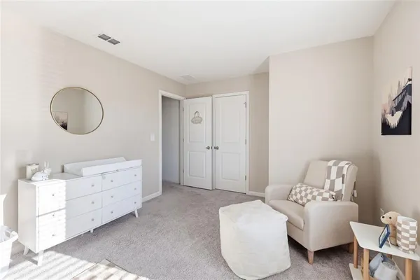 a living room with furniture and a bathroom