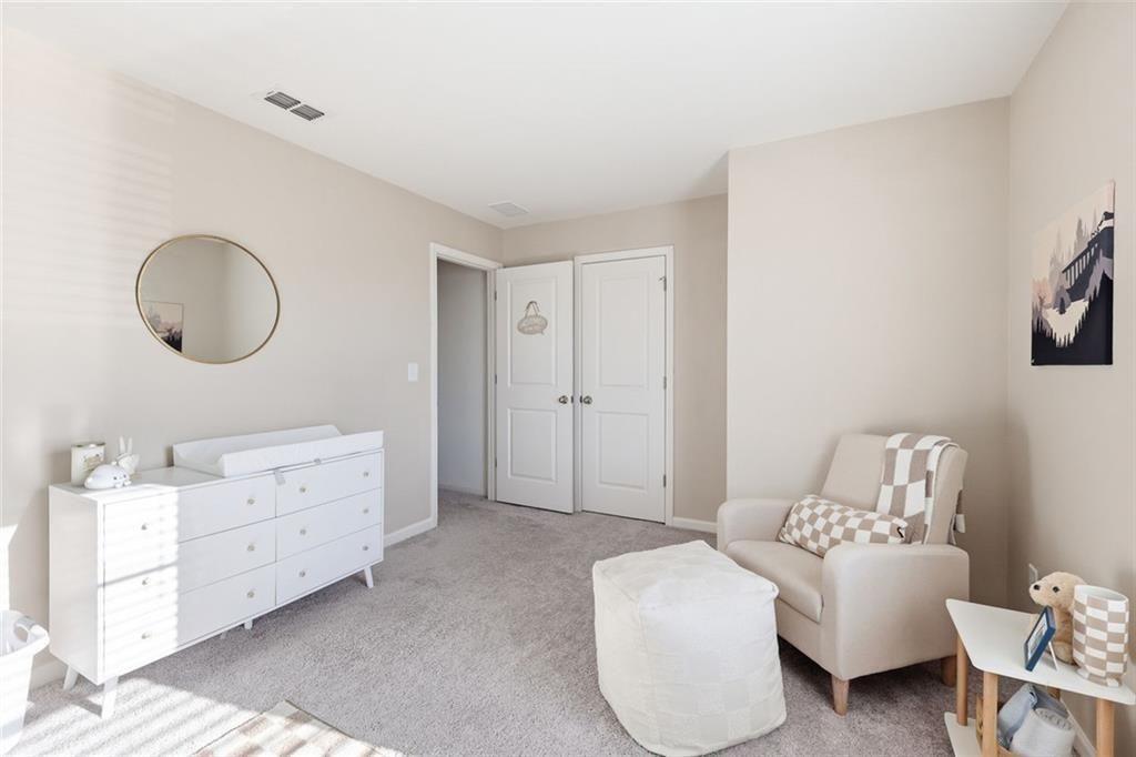 628 Knightsbridge Lane Winder, GA 30680 - Photo 29 of 42 a living room with furniture and a bathroom