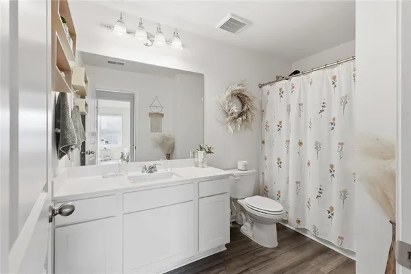 a view of bathroom with a sink toilet and shower