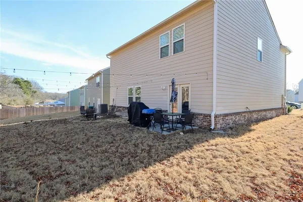 a view of a backyard with sitting area