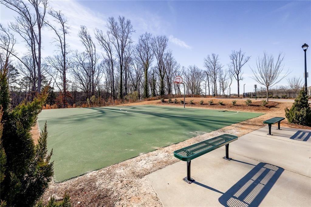 628 Knightsbridge Lane Winder, GA 30680 - Photo 37 of 42 a backyard of a house with lots of green space and fountain