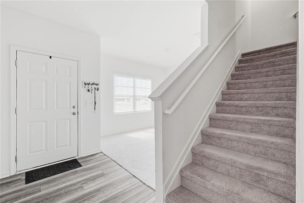 628 Knightsbridge Lane Winder, GA 30680 - Photo 8 of 42 a view of entryway and hall with wooden floor