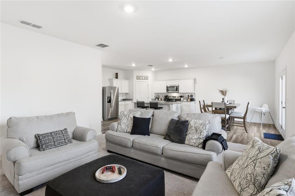 628 Knightsbridge Lane Winder, GA 30680 - Photo 10 of 42 a living room with furniture and a view of kitchen