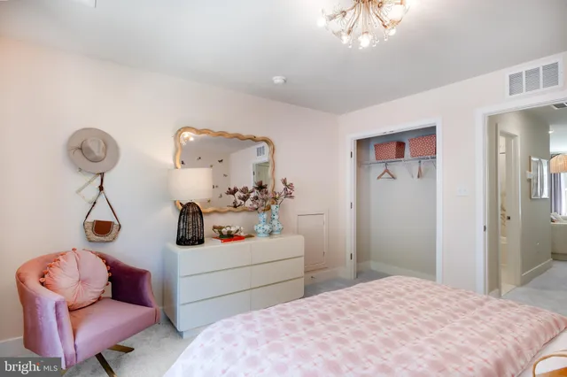 a bedroom with a bed and a couch