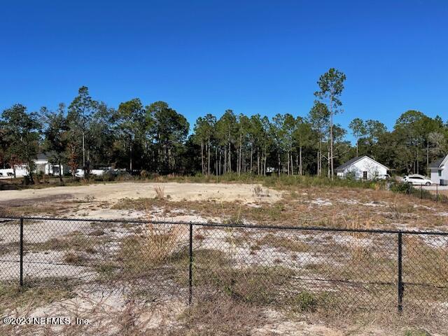0 Springhill Road Fernandina Beach, FL 32034 - Photo 4 of 7 a view of a yard with wooden fence