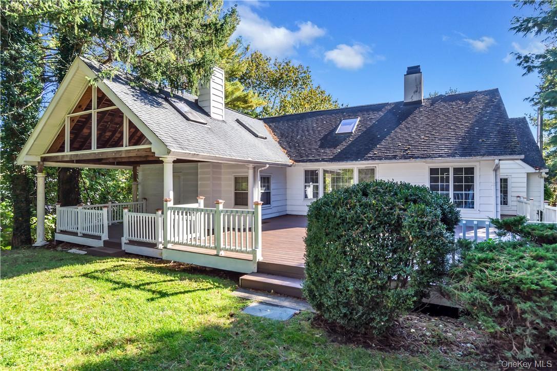a front view of a house with a yard table and chairs