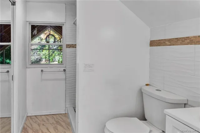 a bathroom with a sink and shower