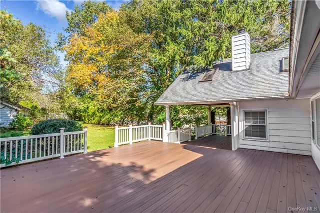 a view of a house with a backyard and a patio