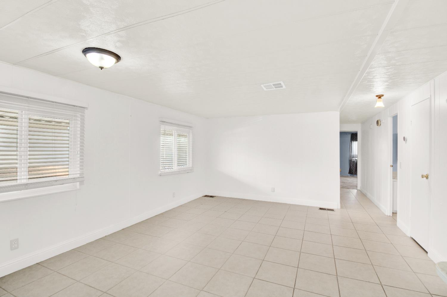 2621 Prescott, Unit 277 Modesto, CA 95350 - Photo 16 of 37 a view of an empty room with a window