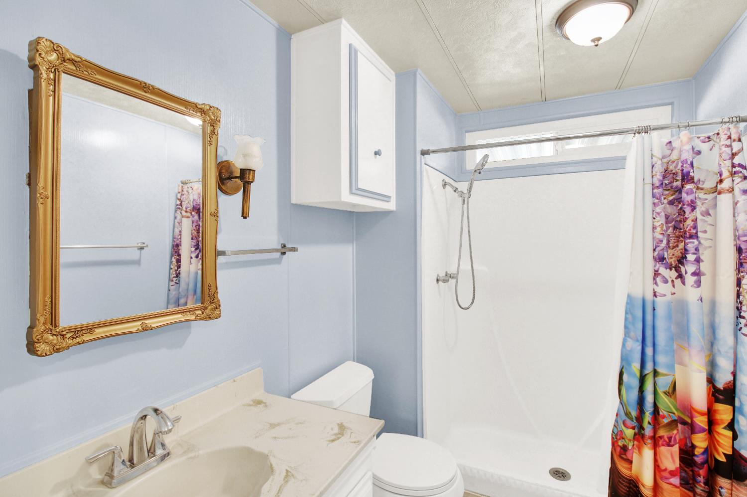 2621 Prescott, Unit 277 Modesto, CA 95350 - Photo 19 of 37 a bathroom with a shower toilet and sink