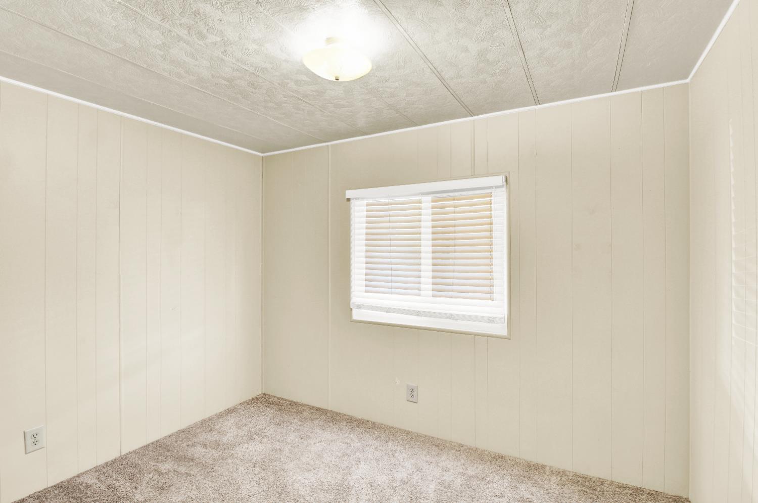 2621 Prescott, Unit 277 Modesto, CA 95350 - Photo 20 of 37 a view of an empty room with a window