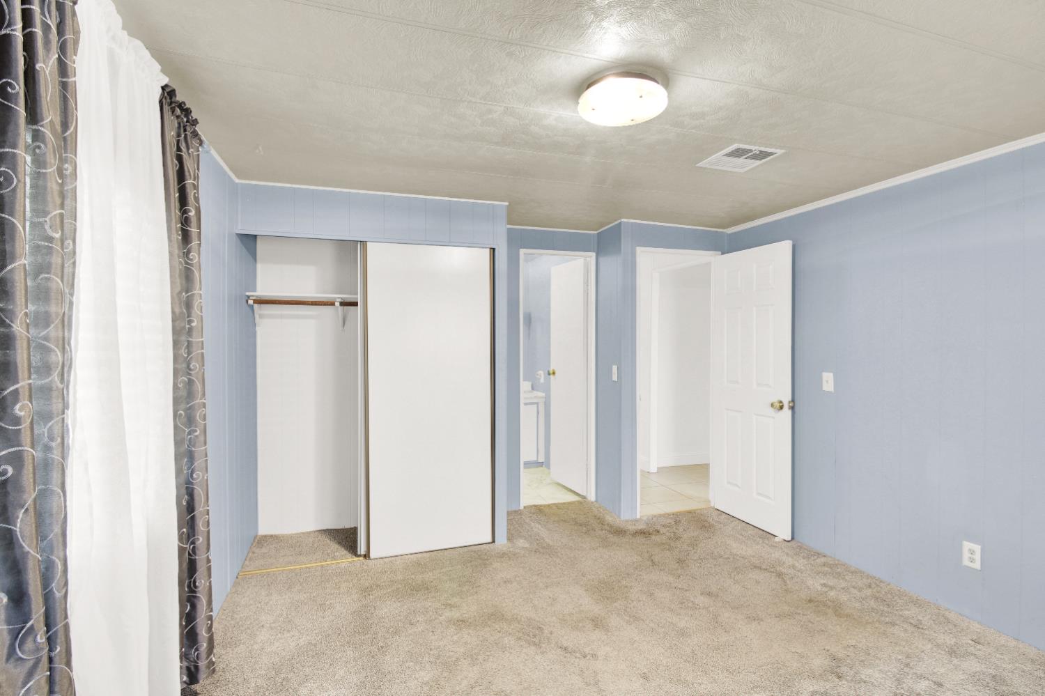 2621 Prescott, Unit 277 Modesto, CA 95350 - Photo 26 of 37 a view of a room with a ceiling fan