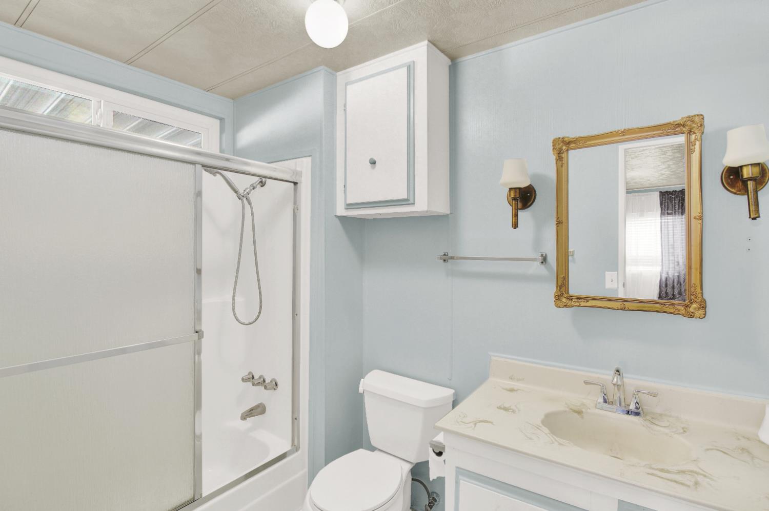 2621 Prescott, Unit 277 Modesto, CA 95350 - Photo 27 of 37 a bathroom with a sink toilet and shower