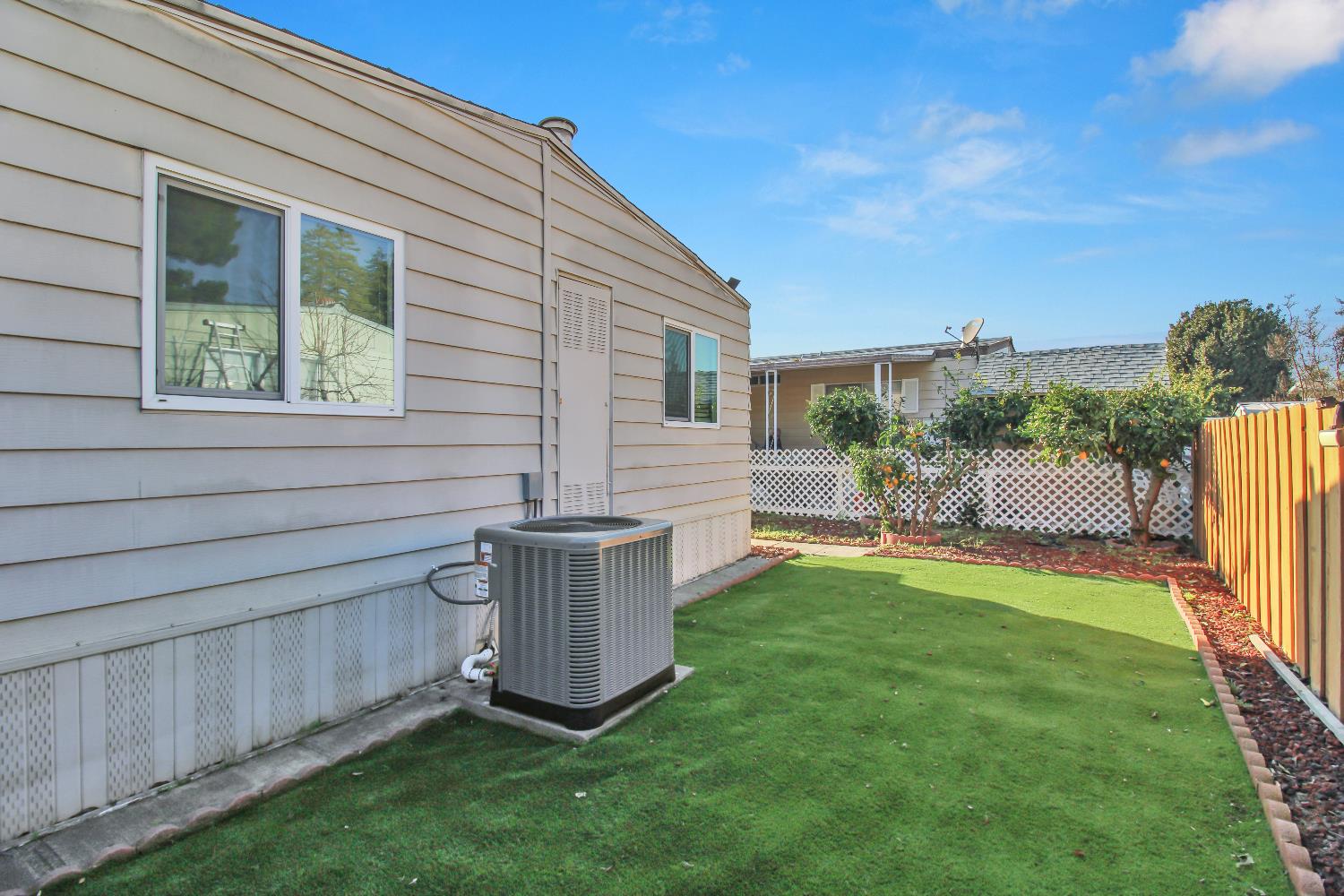 2621 Prescott, Unit 277 Modesto, CA 95350 - Photo 29 of 37 a view of a backyard with plants and a patio