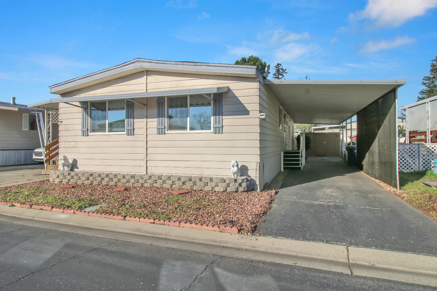 2621 Prescott, Unit 277 Modesto, CA 95350 - Photo 4 of 37 a view of a house with a small yard