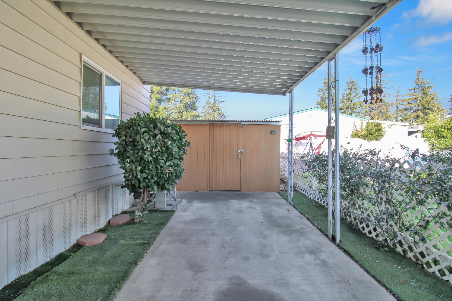 2621 Prescott, Unit 277 Modesto, CA 95350 - Photo 7 of 37 a view of a house with a backyard and garden