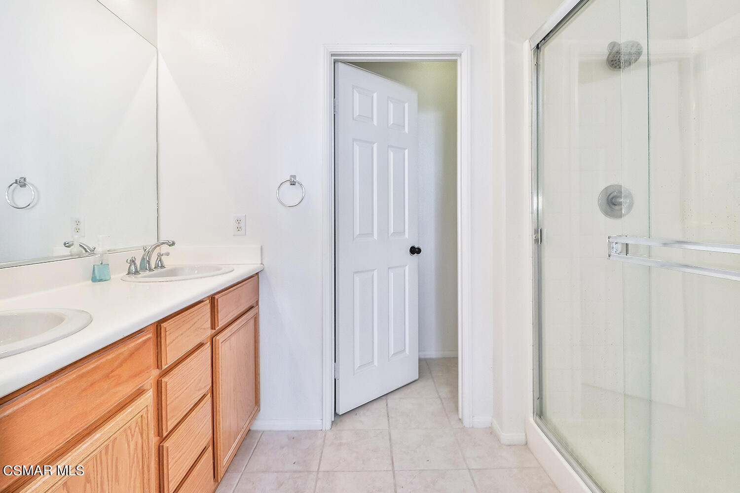 2317 Shakespeare Drive, Unit 9 Oxnard, CA 93033 - Photo 10 of 16 a bath room with a sink and a mirror