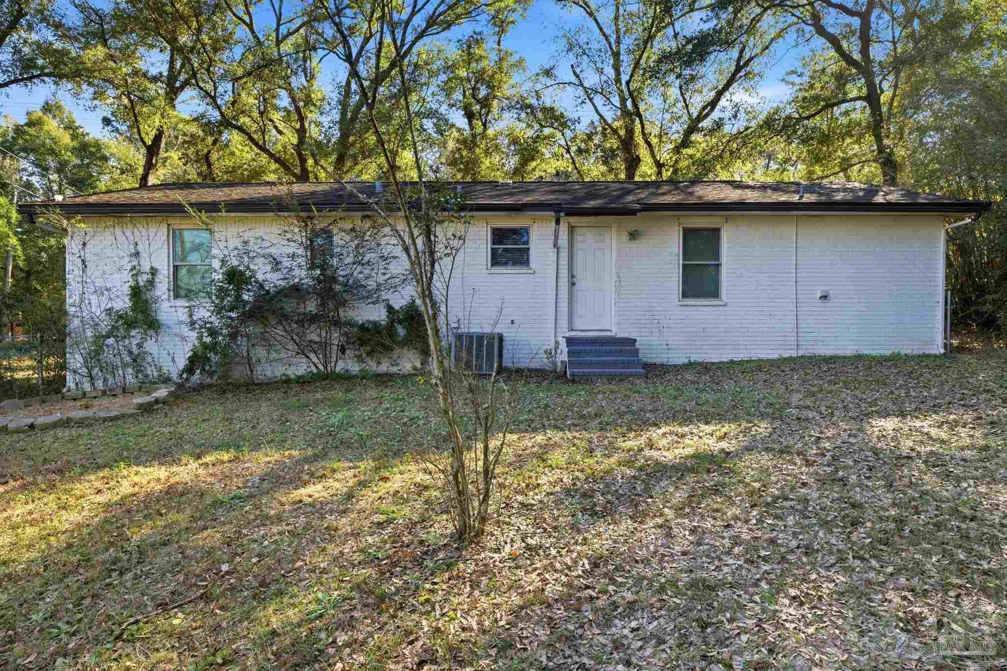 2162 Old Chemstrand Road Cantonment, FL 32533 - Photo 18 of 24 a backyard of a house with lots of green space