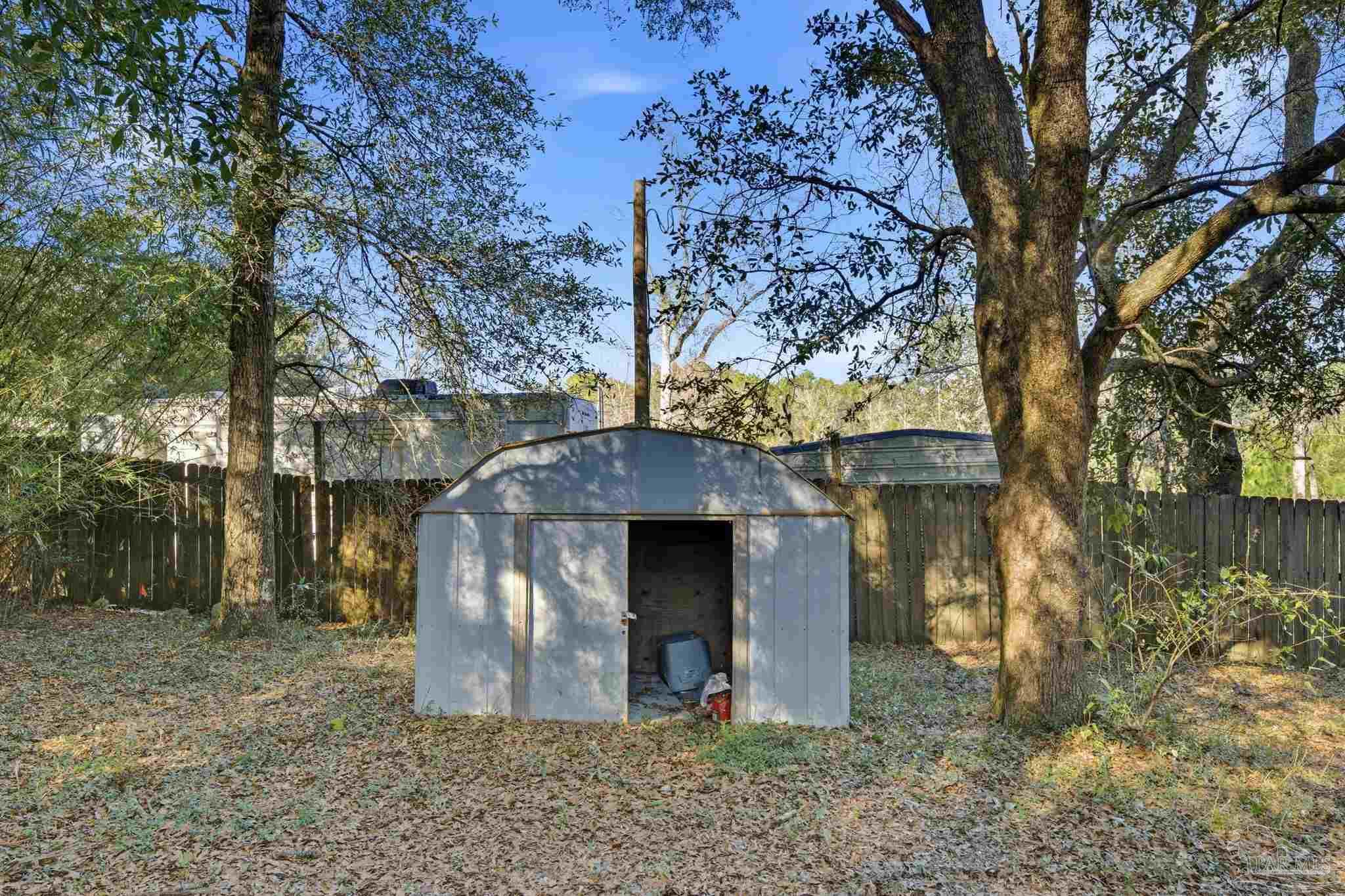 2162 Old Chemstrand Road Cantonment, FL 32533 - Photo 20 of 24 a view of a large tree in front of a house