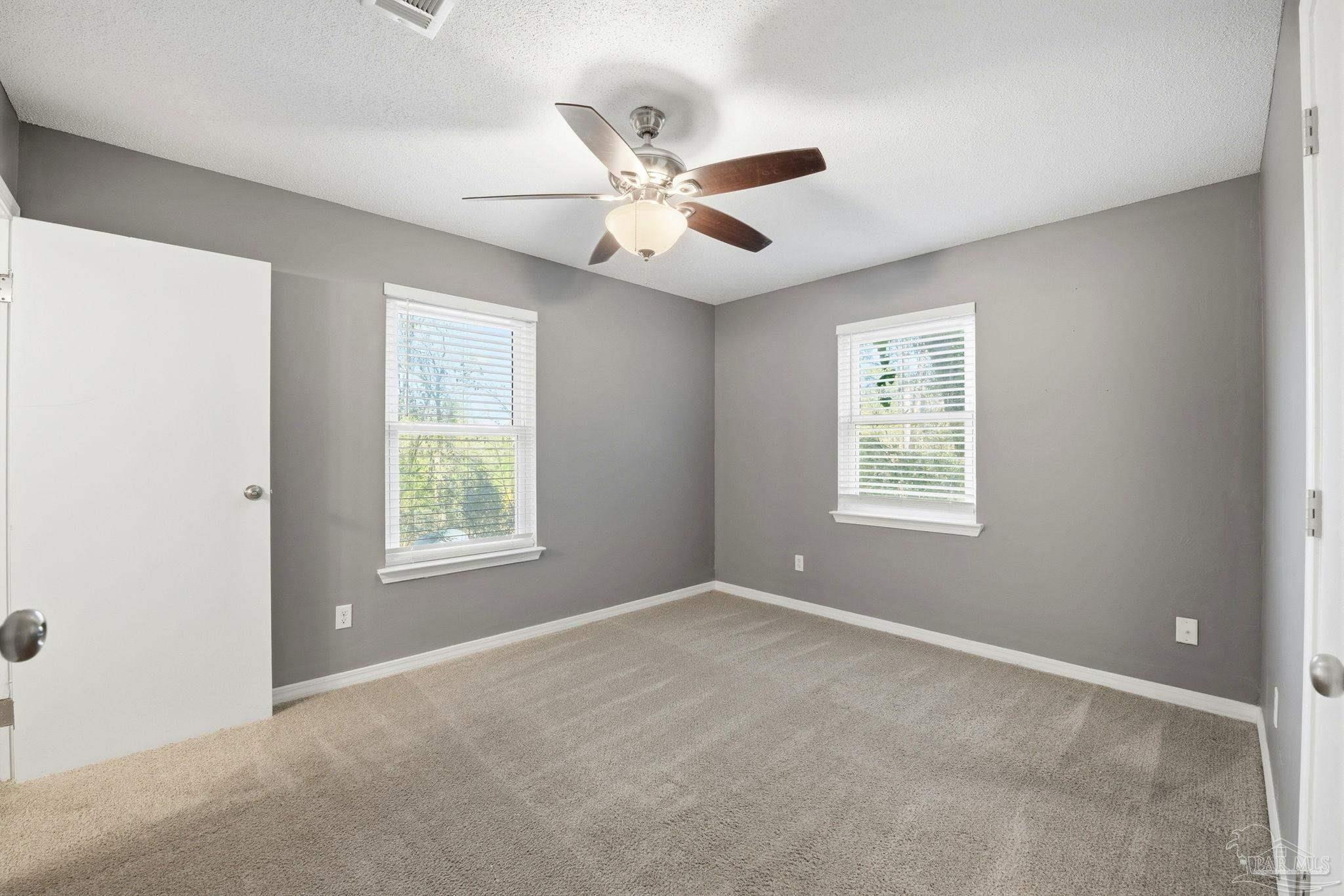 2162 Old Chemstrand Road Cantonment, FL 32533 - Photo 8 of 24 a view of an empty room with a window