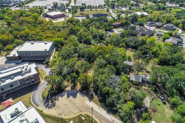 an aerial view of a house with yard swimming pool and outdoor seating