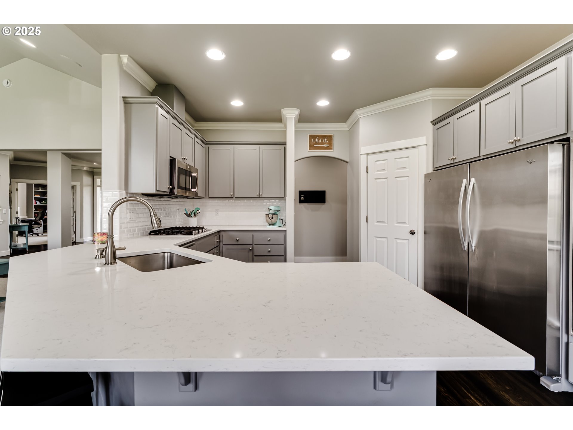 812 Mint Meadow Way Springfield, OR 97477 - Photo 11 of 45 a kitchen with stainless steel appliances a refrigerator sink stove microwave and cabinets