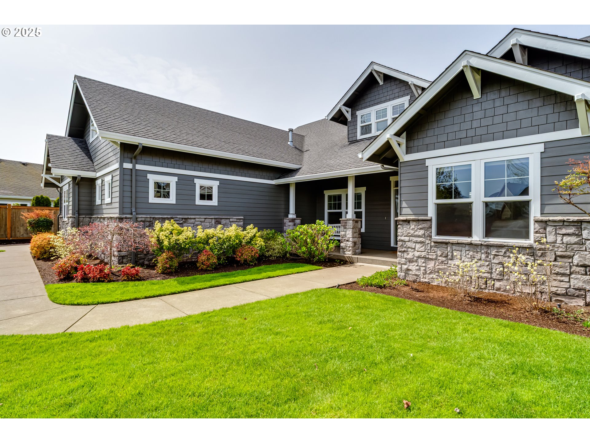 812 Mint Meadow Way Springfield, OR 97477 - Photo 3 of 45 a front view of a house with a garden