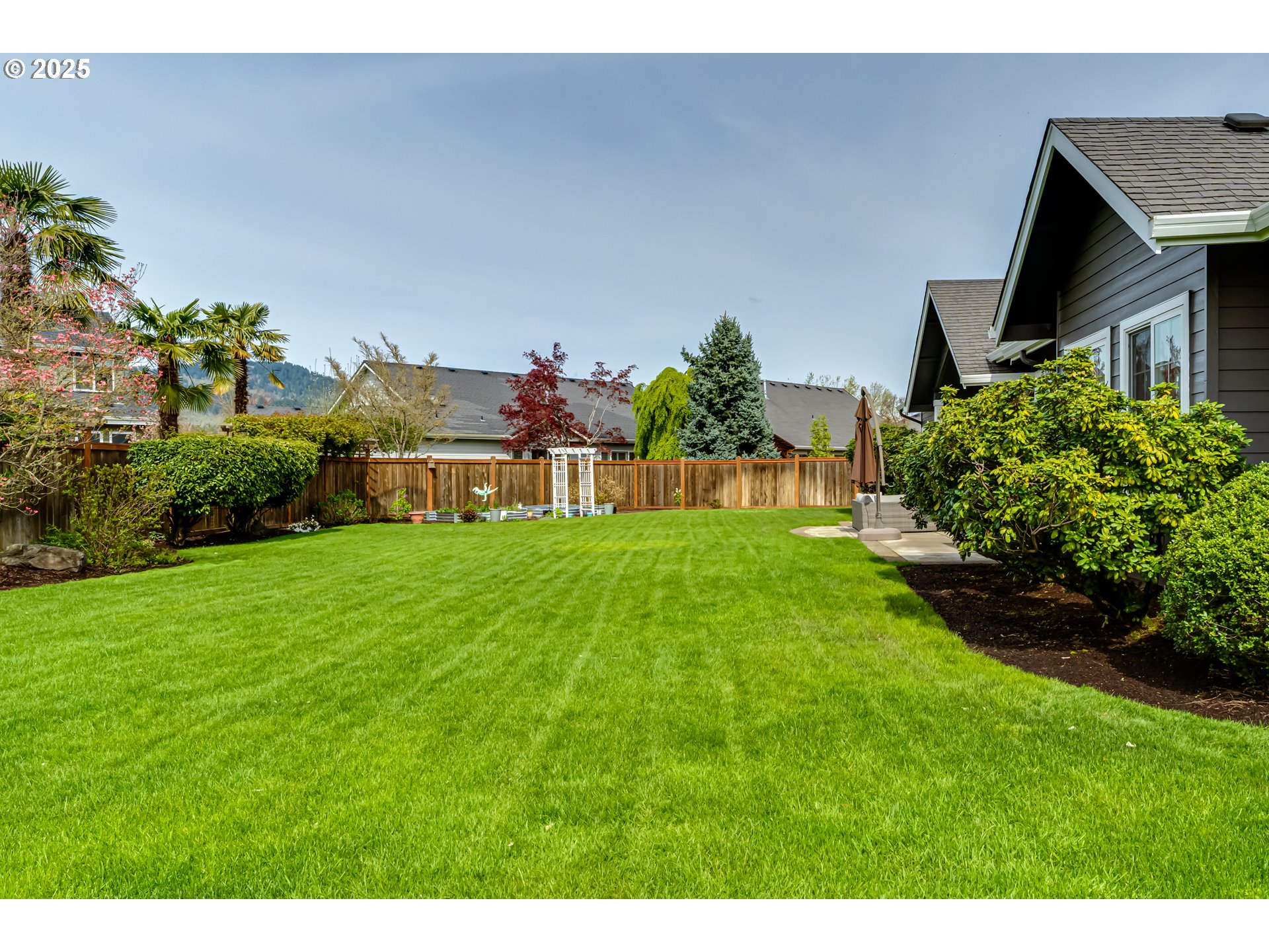 812 Mint Meadow Way Springfield, OR 97477 - Photo 39 of 45 a view of house with garden space and a car parked in front of it