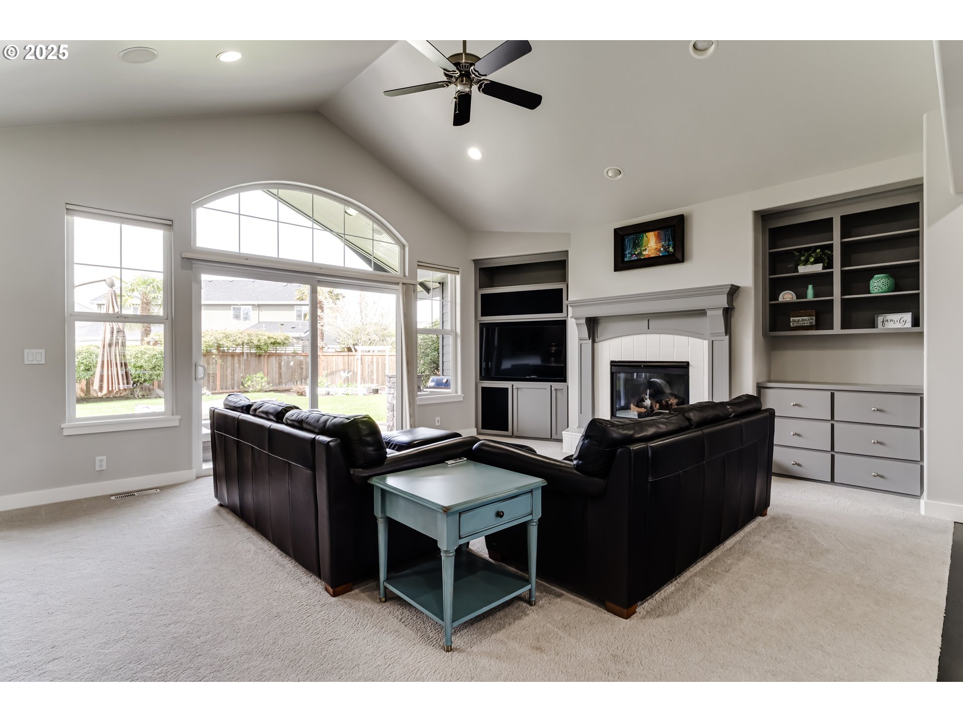 812 Mint Meadow Way Springfield, OR 97477 - Photo 8 of 45 a living room with furniture fireplace and large windows