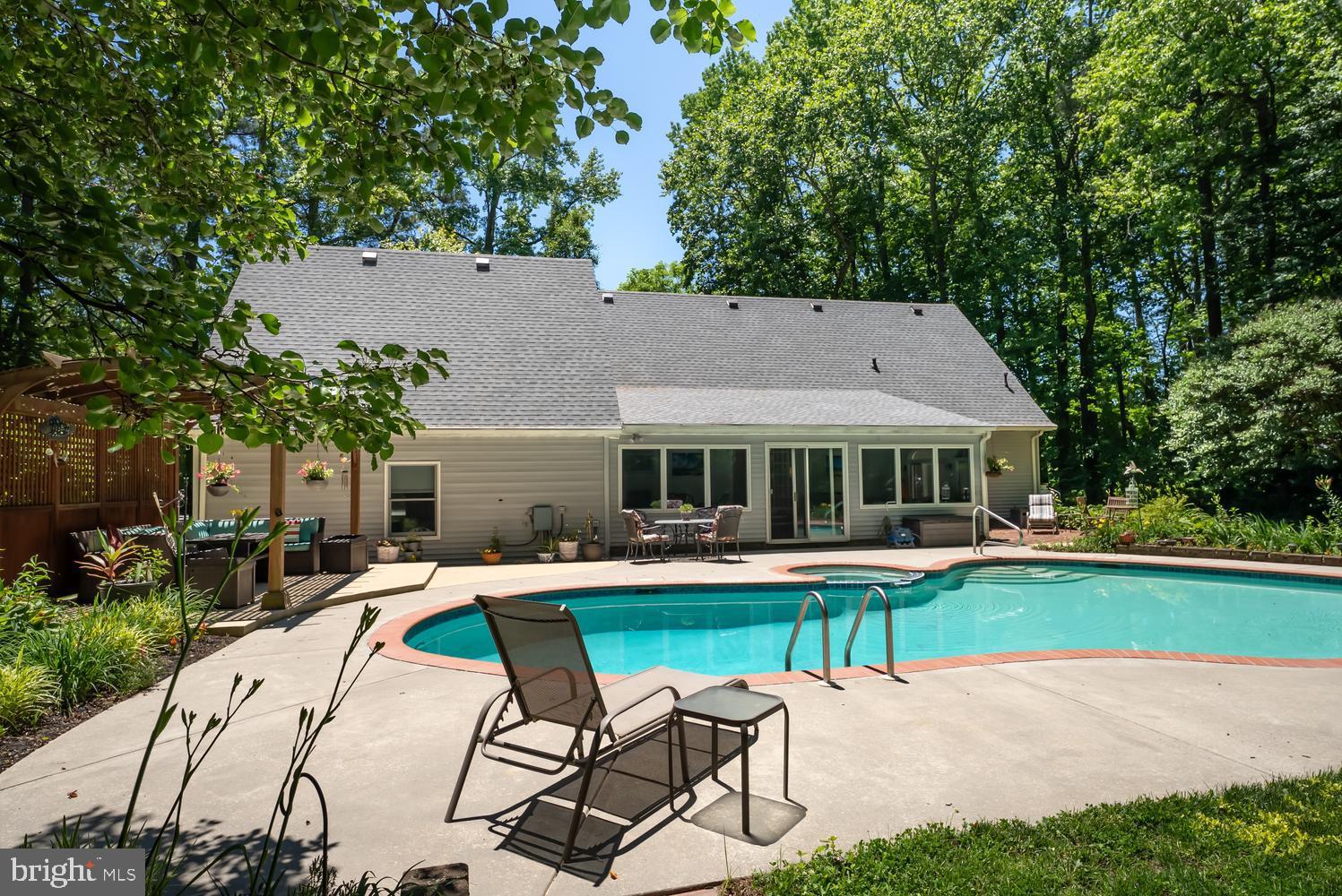 814 Wrights Neck Road Centreville, MD 21617 - Photo 11 of 53 a patio with sofas fire pit table and chairs