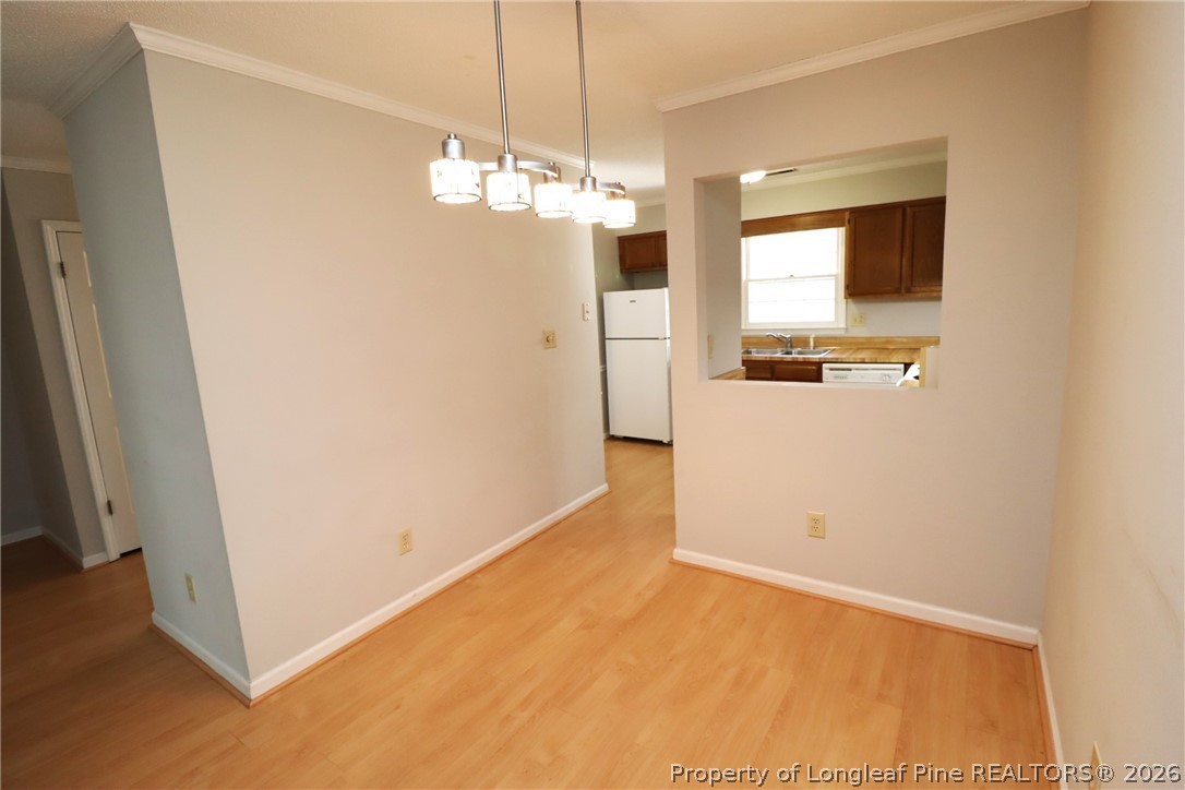 7424 Penny Hill Lane Raleigh, NC 27615 - Photo 12 of 30 a view of a kitchen with a refrigerator