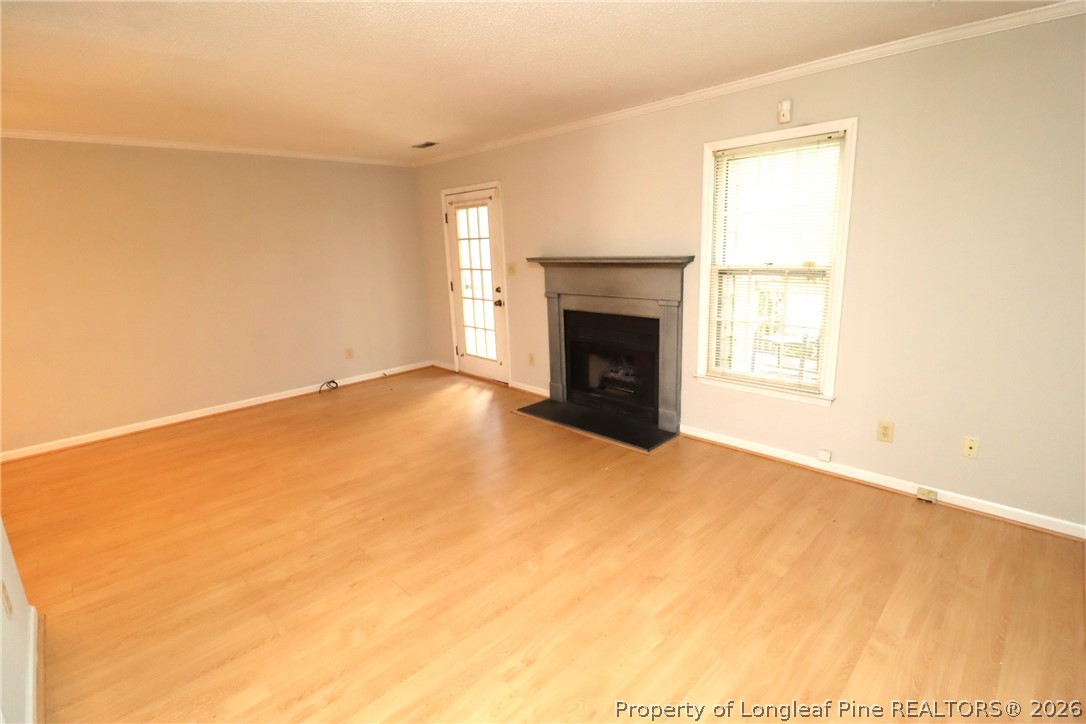 7424 Penny Hill Lane Raleigh, NC 27615 - Photo 15 of 30 an empty room with a fireplace