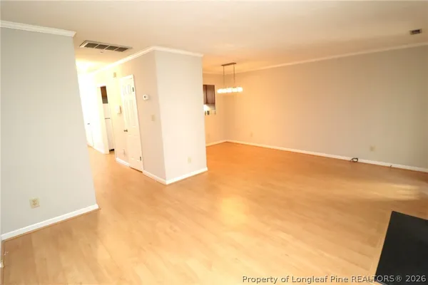 a view of a small space with wooden floor