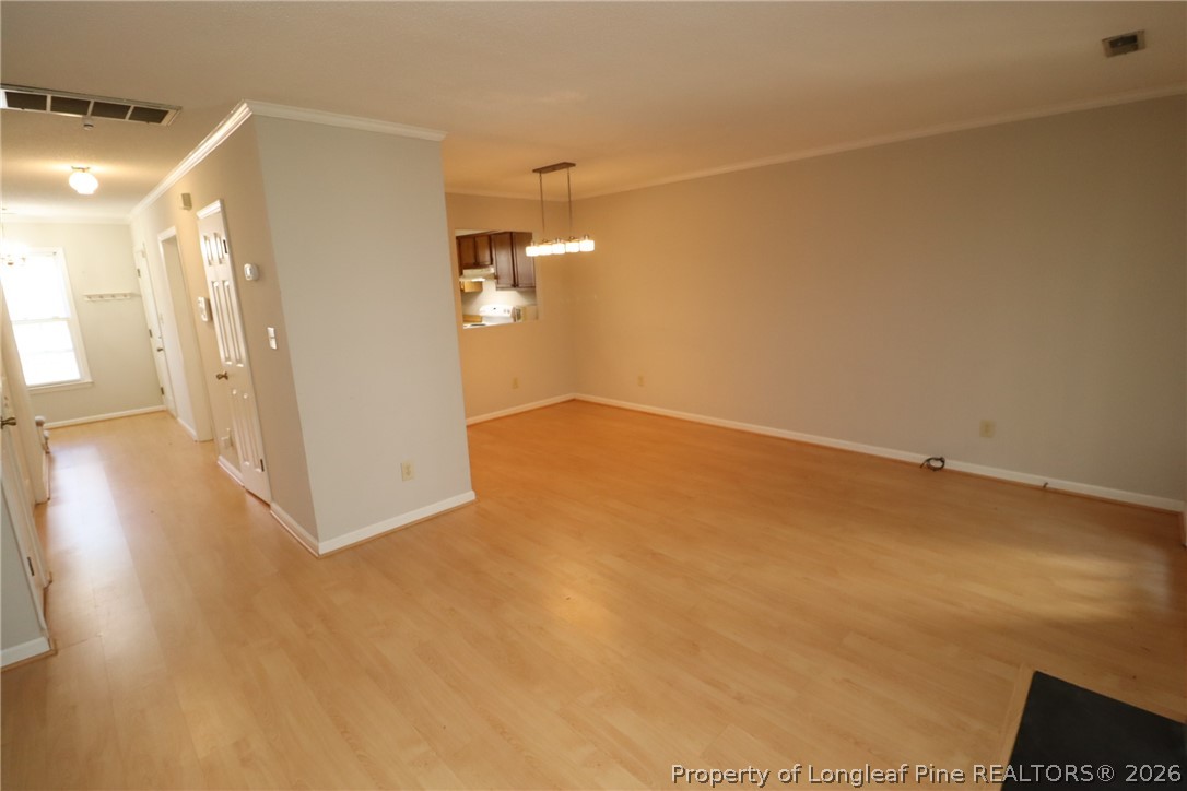 7424 Penny Hill Lane Raleigh, NC 27615 - Photo 18 of 30 a view of a room with wooden floor and a window