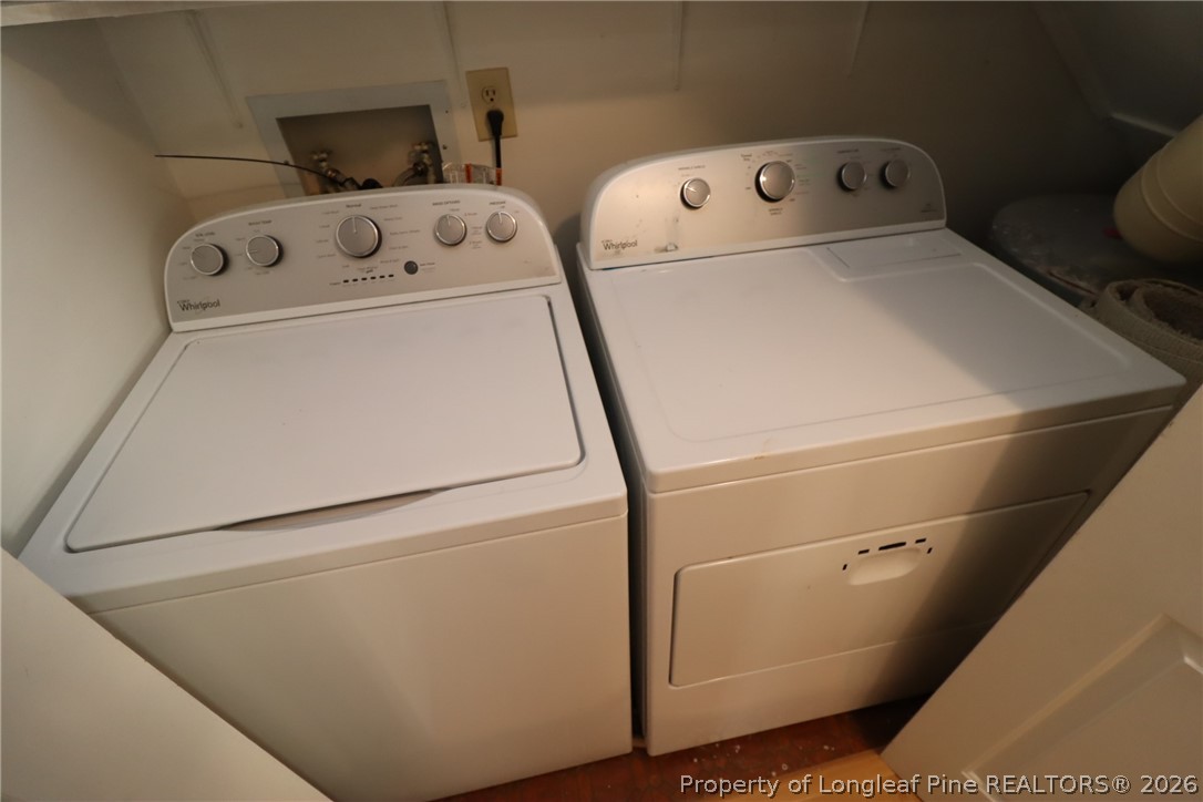 7424 Penny Hill Lane Raleigh, NC 27615 - Photo 20 of 30 a utility room with dryer and washer