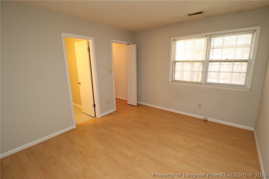7424 Penny Hill Lane Raleigh, NC 27615 - Photo 22 of 30 an empty room with windows