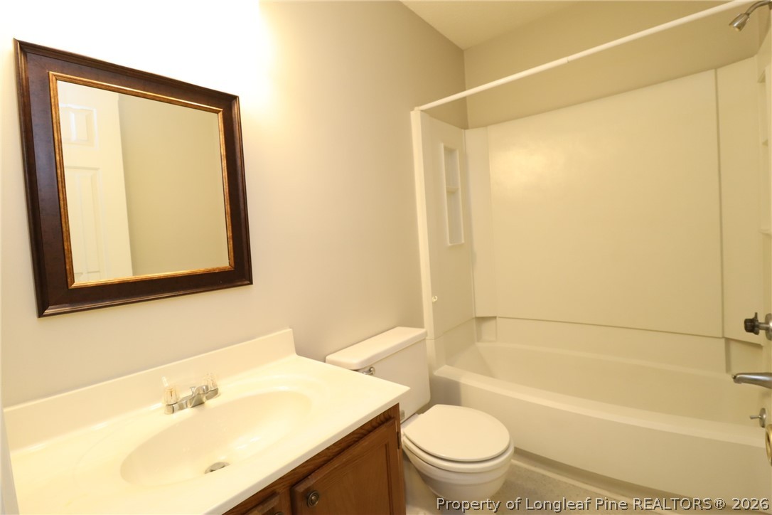 7424 Penny Hill Lane Raleigh, NC 27615 - Photo 27 of 30 a bathroom with a sink toilet and shower