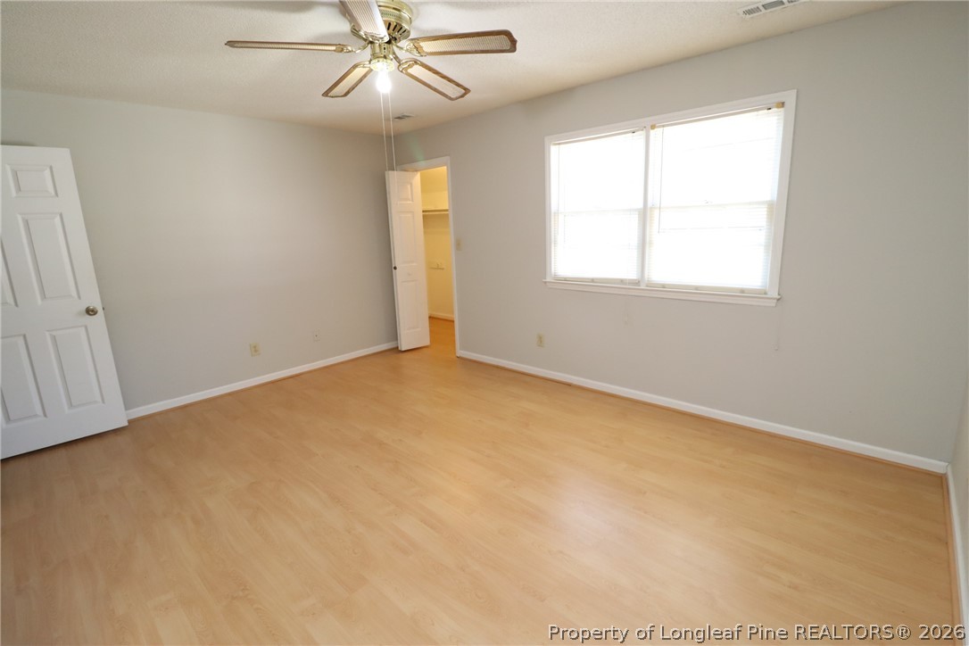 7424 Penny Hill Lane Raleigh, NC 27615 - Photo 29 of 30 an empty room with windows and fan