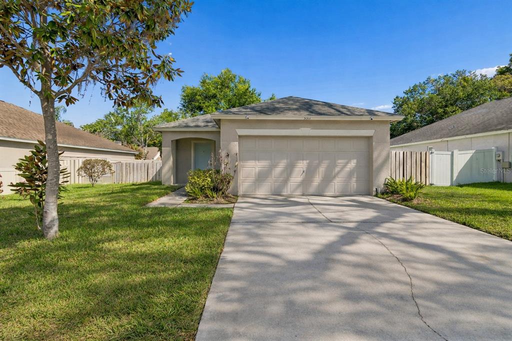 5311 Watson Road Riverview, FL 33578 - Photo 1 of 33 a front view of a house with garden