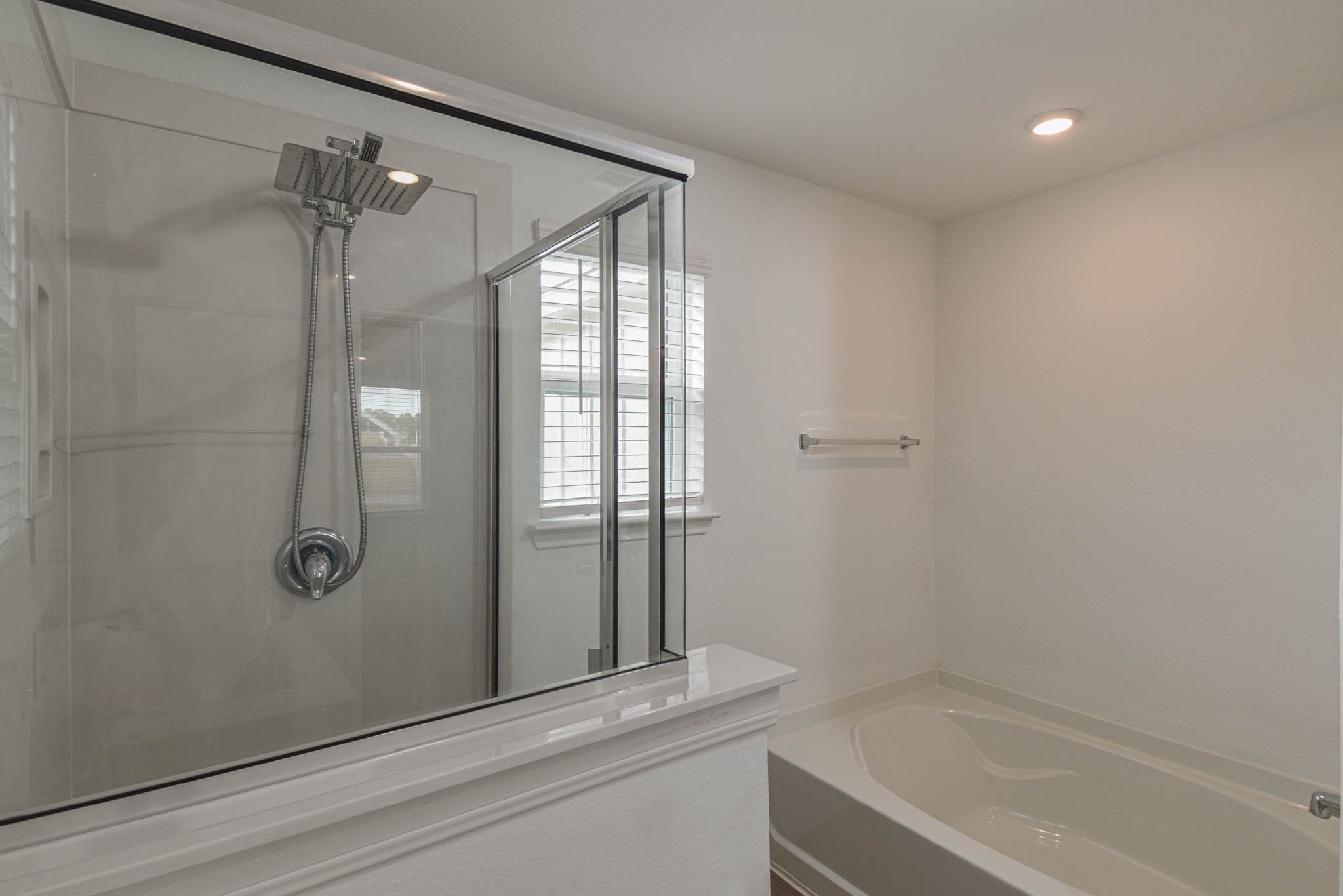 5727 Finely Run Street Spring, TX 77373 - Photo 16 of 26 a bathroom with a shower and a mirror