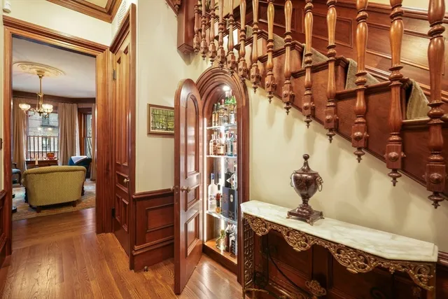 a view of living room kitchen and entryway